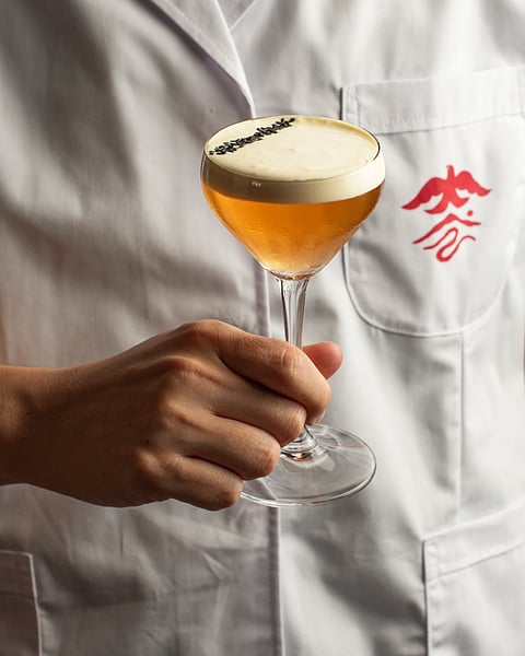 Kowloon Dairy (Hong Kong interpretation of the milk punch: roselle and magnolia amaros by local brand Magnolia Lab are blended with for ma yun—hemp seed— syrup and pu’er tea, then clarified and topped off with a salted cream cap).
